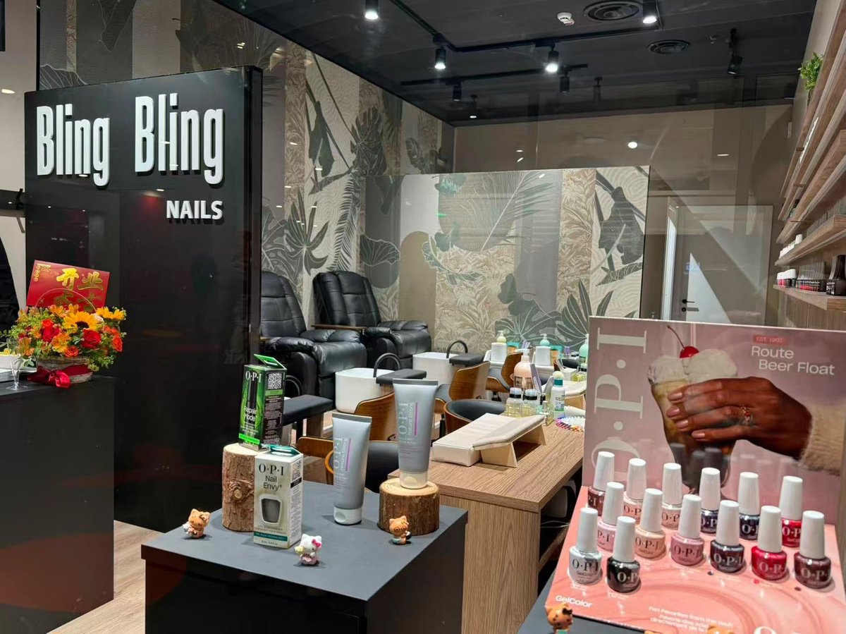 Bling Bling Nails salon storefront with black signage, nail polish display, and professional nail services interior